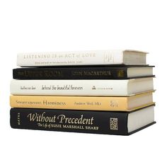 four books stacked on top of each other with the title without precedent written