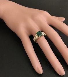 2.80 Carats Natural Emerald and Diamond 14K Solid Yellow Gold Ring Suggested Replacement Value: $5,200.00 Total Natural Green Emerald Weight is: Approx. 2.40 Carats (transparent) Emerald Measures: Approx. 8.00 x 6.70mm Natural Round Diamonds Weight: Approx. 0.40 Carats (color G-H / Clarity SI1-SI2) Ring total weight: Approx. 6.0 grams Disclaimer: all weights, measurements and colors are approximate and may vary slightly from the listed dimensions or as seen in the image. All pictures are magnifi Luxury Green Rings With Vs Clarity, Elegant Collectible Emerald Ring With Prong Setting, Formal Green Princess Cut Diamond Ring, Green Diamond Ring With Vs Clarity, Luxury Green Diamond Ring With Vs Clarity, Elegant Green Diamond Ring Vs Clarity, Formal Asscher Cut Emerald Ring, Elegant Emerald Cut Emerald Ring, Elegant Emerald Cut Emerald Ring For Collectors