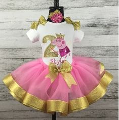 a pink and gold peppa pig birthday dress with the number two on it's chest