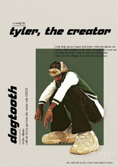 a man kneeling down in front of a poster with the caption tyler, the creator