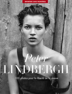 a black and white photo of a woman in front of a wooden wall with the words peter lindbberg