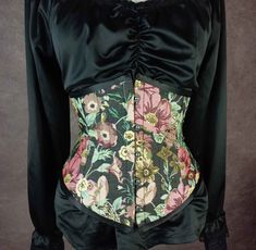 The ultra flattering and easy to wear Lilly underbust corset in beautiful black floral tapestry fabric.  My most flattering and comfortable underbust corset - easy to do up by yourself or with a helper.  This is a high quality handmade product. This lovely style gives a fantastic waist shape and suits most figure types.  The steel boned Lilly gives great waist compression and is made to last for years and years.  Combining a front busk and back lacing to make this steel boned corset easy to adju Floral Print Underbust Corset, Floral Print Overbust Corset With Fitted Bodice, Fitted Overbust Corset Dress With Floral Print, Vintage Floral Print Fitted Corset, Fitted Vintage Floral Print Corset, Vintage Fitted Floral Print Corset, Vintage Floral Print Overbust Corset, Vintage Overbust Floral Print Corset, Vintage Overbust Corset With Floral Print