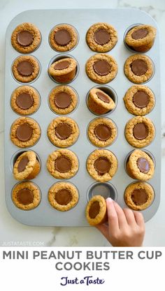 mini peanut butter cup cookies on a cookie sheet