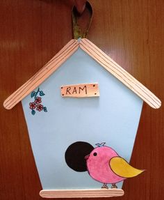 a birdhouse with the word ram painted on it