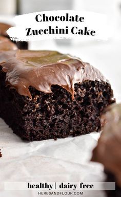 a chocolate zucchini cake with frosting on top