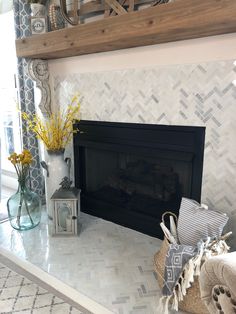 a living room with a fireplace and decorative items on the mantle