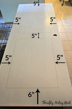 the measurements for an unfinished cabinet door are shown in front of a kitchen counter top