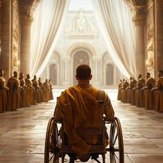 a man in a wheel chair looking at a line of people wearing robes and cloaks