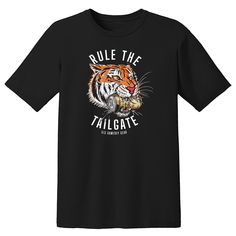 Long before the Bengals take the field, you're making all of the preparations to Rule The Tailgate! Regardless of the outcome of the game, you'll always be the champion! Unisex Printed on a super soft, black cotton tee. Collegiate Black T-shirt For Football Season, Black Fan Gear T-shirt With Text Print, Black T-shirt With Text Print For Fans, Black T-shirt With Football Season Text Print, Black T-shirt With Text Print For Football Season, Collegiate Black Pre-shrunk T-shirt, Collegiate Pre-shrunk Black T-shirt, Black T-shirt For Game Day Football Season, Black T-shirt With Screen Print For Fan Gear