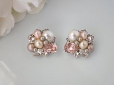 Asymmetrical blush post earring Swarovski by BlingBaddaBoom Pink Cluster Jewelry For Wedding, Pink Feminine Pearl Earrings For Wedding, Feminine Pink Pearl Earrings For Wedding, Elegant Cluster Bridal Earrings For Wedding, Pink Pearl Bridal Earrings As Gift, Pink Pearl Bridal Earrings For Gift, Pink Pearl Bridal Earrings For Wedding, Wedding Jewelry With Matching Cluster Earrings, Pink Pearl Drop Earrings For Wedding