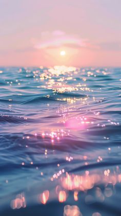 the sun shines brightly over the ocean water as it reflects on the surface of the water