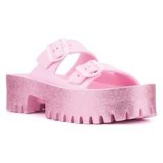 For effortless summer style from beach to boardwalk, slip into our Sparkles slide sandal. Its glitter finish adds a touch of illumination to the double-strap upper, complemented by a sturdy lug sole for comfort and traction. Perfect for casual outings or seaside adventures, the Sparkles sandal combines chic design with practicality, ensuring you shine brightly wherever you go this summer. Pink Slides With Textured Footbed For Vacation, Pink Synthetic Footbed Sandals For Spring, Pink Textured Footbed Sandals For Summer, Trendy Pink Platform Slides, Pink Platform Jelly Sandals For Beach, Pink Slides With Textured Footbed, Pink Glitter Sandals For Summer, Pink Slide Flip Flops With Textured Footbed, Glitter Jelly Sandals With Round Toe For Summer