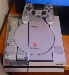 the sony playstation is sitting on top of its box and ready to be used as a game console