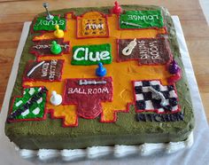 a cake that is sitting on top of a wooden table with writing and pictures on it