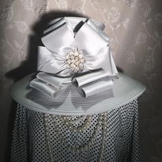 Brand New With Tags. Was On Display In My Boutique And Has Been Tried On In My Boutique So The Interior Shows A Tad Of Makeup, I Will Try And Clean. Price Accordingly. The Color Is A Light Dove Grey And Flower Crystals Are Clear. Most Hats Are 22.5" Is Standard Size. Brim Width Is Approx 5.5", Over All Width Is Approx 18". 6" Deep. Elegant Silver Hat For Spring, Elegant Silver Spring Hat, Dove Grey, On Display, Derby, Bucket Hat, Women Accessories, Boutique, Brand New