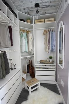 a walk in closet filled with lots of clothes