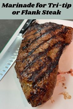 there is a piece of steak on the plate next to a knife and fork with text overlay that says marinade for tri - tip or plank steak