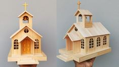 a wooden model of a church being held up by someone's hand and the other side is made out of wood