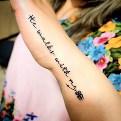 a woman with a tattoo on her arm that says, i love you in chinese