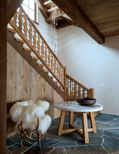 a room with a table and some stairs