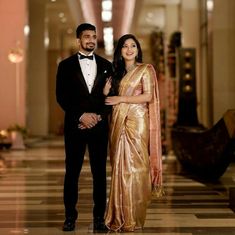 a man and woman in formal wear standing together