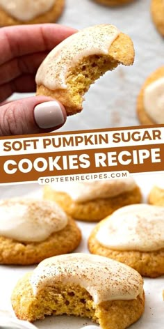 soft pumpkin sugar cookies with frosting being held up by a person's hand