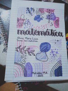 an open notebook with the words madenadia written in spanish on top of it