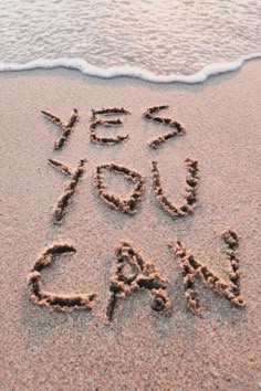 the words yes and no are written in the sand