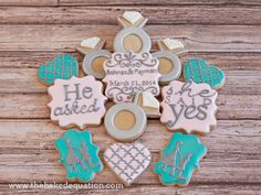 decorated cookies are arranged in the shape of a cross with words on them and hearts