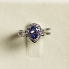 "Description Silver -925 Ring size:- 6 US Stone Name:- natural emerald and tanzanite Stone Size- 7x5 MM Stone shape:-l Pear Item No. D-42 \"Payment\" We Accept Payment Only Through PayPal\"Shipping \"Handling Time: We Take no handling time, We ship to Worldwide,Please make sure your shipping address is correct.Shipping Services: The shipping company takes business to deliver the product 7-13 days for International Shipping.,The Item will be shipped in safe and beautiful packing.Business day does Silver Teardrop Halo Rings, Silver Halo Teardrop Rings, Silver Pear-shaped Rings With Halo Detail, Silver Pear-shaped Halo Ring, Silver Setting Pear-shaped Emerald Promise Ring, Silver Pear-shaped Ring With Birthstone, Silver Pear-shaped Emerald Promise Ring, Pear-shaped Silver Emerald Promise Ring, Silver Teardrop Emerald Ring For Anniversary