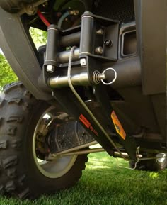 the front end of a large vehicle on grass