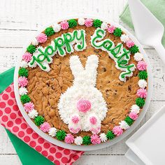 a cookie cake decorated with flowers and icing