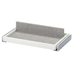 a gray and white tray with two compartments