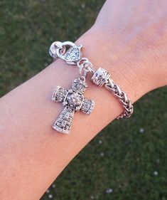 This pretty crystal cross bracelet is a perfect treat for yourself or gift for a loved one. The cross is made of Antique silver plated, lead~free, nickel~free, cadmium~free   Stainless steel braided bracelet fitting up to an 8" wrist  Quantity: 1 Bracelet as shown     Thank you for visiting my shop! Nickel Free Silver Cross Bracelets, Nickel Free Cross Bracelet With Spiritual Style, Silver Cross Rosary Bracelet, Spiritual Silver Charm Bracelet With Cross, Spiritual Silver Cross Bracelet, Spiritual Silver Cross Charm Bracelet, Nickel-free Cross Bracelet Gift, Elegant Cross-shaped Beaded Bracelets As Gift, Nickel-free Silver Cross Bracelets