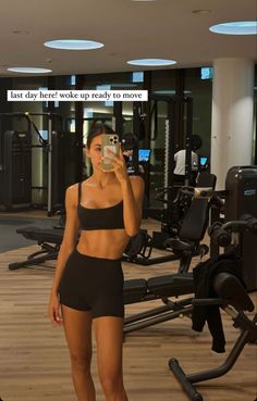 a woman taking a selfie in the gym