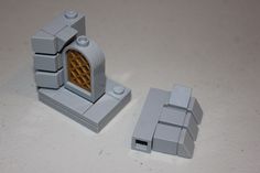 two lego pieces sitting next to each other on a white counter top, one has a small window and the other has a door