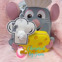 Remy Ratatouille Mouse Chef Inspired Minnie Mickey Ears Holder, Sunglasses Holder, Hat Holder, Rat Chef, Remy Ears  Use this adorable holder for stowing ears, sunglasses, hats, and keys while visiting the parks.  Fast shipping and last minute orders accepted.  * Handmade item * Ready to ship * one size fits most ears, caps, keys, sunglasses * hardware included Ratatouille Mouse, Remy Ratatouille, Chef Inspiration, Sunglasses Holder, Hat Holder, Chef Hat, Handmade Boutique, Chefs Hat, Sunglass Holder