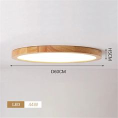 an image of a wooden ceiling light with dim lighting on the side and measurements for it