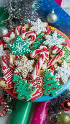 a plate full of christmas cookies and candy canes