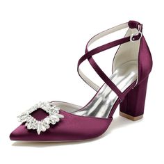 a pair of women's purple high heeled shoes with an embellishment