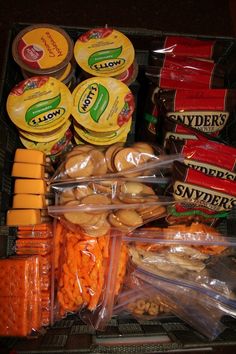 an assortment of snacks and condiments in plastic containers