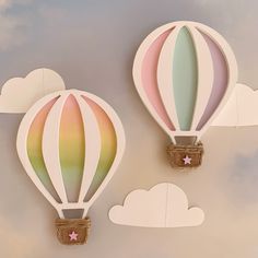 two paper hot air balloons in the sky