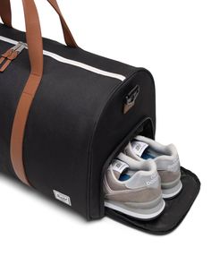 Travel tough and cleverly organized, this is the ultimate road trip duffle, built with our signature shoe compartment for that spare pair. Made with 100% recycled EcoSystem™ fabrics, it fits perfectly the overhead bin or the trunk of your car. EcoSystem™ 600D Fabric made from 100% recycled post-consumer water bottles Tonal stripe EcoSystem™ Liner made from 100% recycled post-consumer water bottles Waterproof zippered closure protects your essentials Low profile vegan leather handles Removable sm Ultimate Road Trip, Stationary Gifts, Folding Bag, Satchel Backpack, Pen Accessories, The Trunk, Diaper Bag Backpack, Herschel Supply Co, Unique Shoes