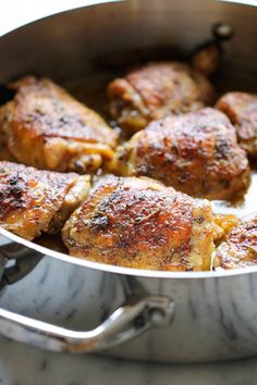 some meat is cooking in a pan on the stove