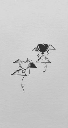 two black and white drawings on paper with mountains, clouds and stars in the sky