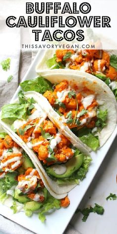 buffalo cauliflower tacos on a plate with lettuce