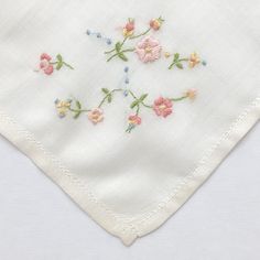 "One of a kind new and unused hand embroidered 'Love You' new vintage cotton lawn handkerchief. This delightful cream coloured handkerchief is made from 100% cotton lawn. The handkerchief depicts a machine embroidered design in pink, white, yellow, blue and green thread in one corner. Machine embroidered plain edged boarders complete this delightful hankie. I have used 100% colour fast contrasting pink embroidery thread for the \"Love You\" inscription on this gorgeous handkerchief. This lovely Embroidered Flower Handkerchiefs For Gifts, Embroidered Flower Handkerchiefs As Gift, Flower Shaped Embroidered Handkerchiefs For Gift, Flower-shaped Embroidered Handkerchiefs For Gifts, Floral Embroidered Handkerchiefs For Spring Wedding, Spring Wedding Handkerchiefs With Floral Embroidery, Spring Handkerchiefs With Floral Embroidery As Gift, Spring Floral Embroidery Handkerchiefs As Gift, Floral Embroidered Handkerchiefs For Spring Gift