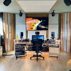 a recording studio with multiple monitors and sound equipment