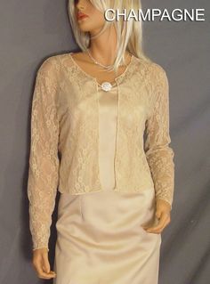 Comfortable and chic! Hip length Lace long sleeve bolero wedding jacket shrug. Perfect for anyone looking for a little extra coverage. Made From 40% Nylon & 60% Soft Rayon Lace Fabric To Give It A Nice Drape & The Stretchability To Last! Newly made in each size and ready to ship. VIEW PICTURES FOR SIZE AND MEASUREMENT CHART If you are needing more then four of this item just let us know. We are happy to offer VOLUME DISCOUNTS We keep several in each size in stock so that we can ship all Elegant Long Sleeve Mother Of The Bride Dress, Spring Formal Fitted Shrug, Elegant Party Shrug For Fall, Elegant Fall Party Shrug, Long Sleeve Shrug For Spring Evenings, Long Sleeve Spring Evening Shrug, Formal Spring Long Sleeve Shrug, Long Sleeve Evening Dress For Mother Of The Bride, Elegant Long Sleeve Fall Shrug