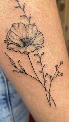 a black and white photo of a flower on the thigh with leaves in it's center